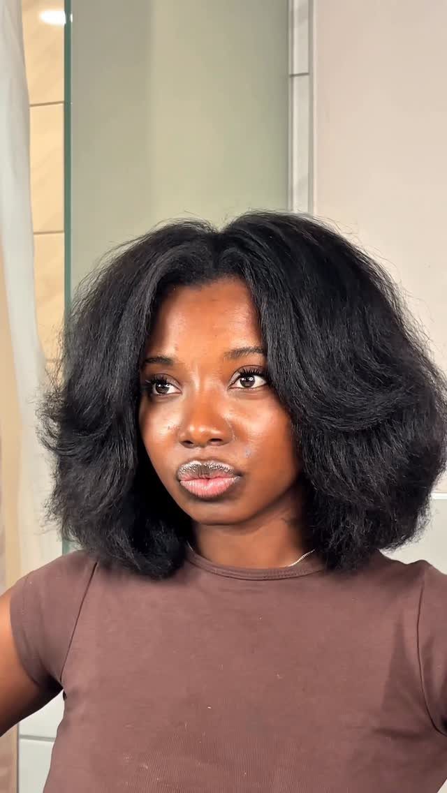 4C Hair Blown Out with Braids, Buns and Waves: 9 Ideas 1 Woman with voluminous, blown-out 4C natural hair in a rounded shoulder-length style.