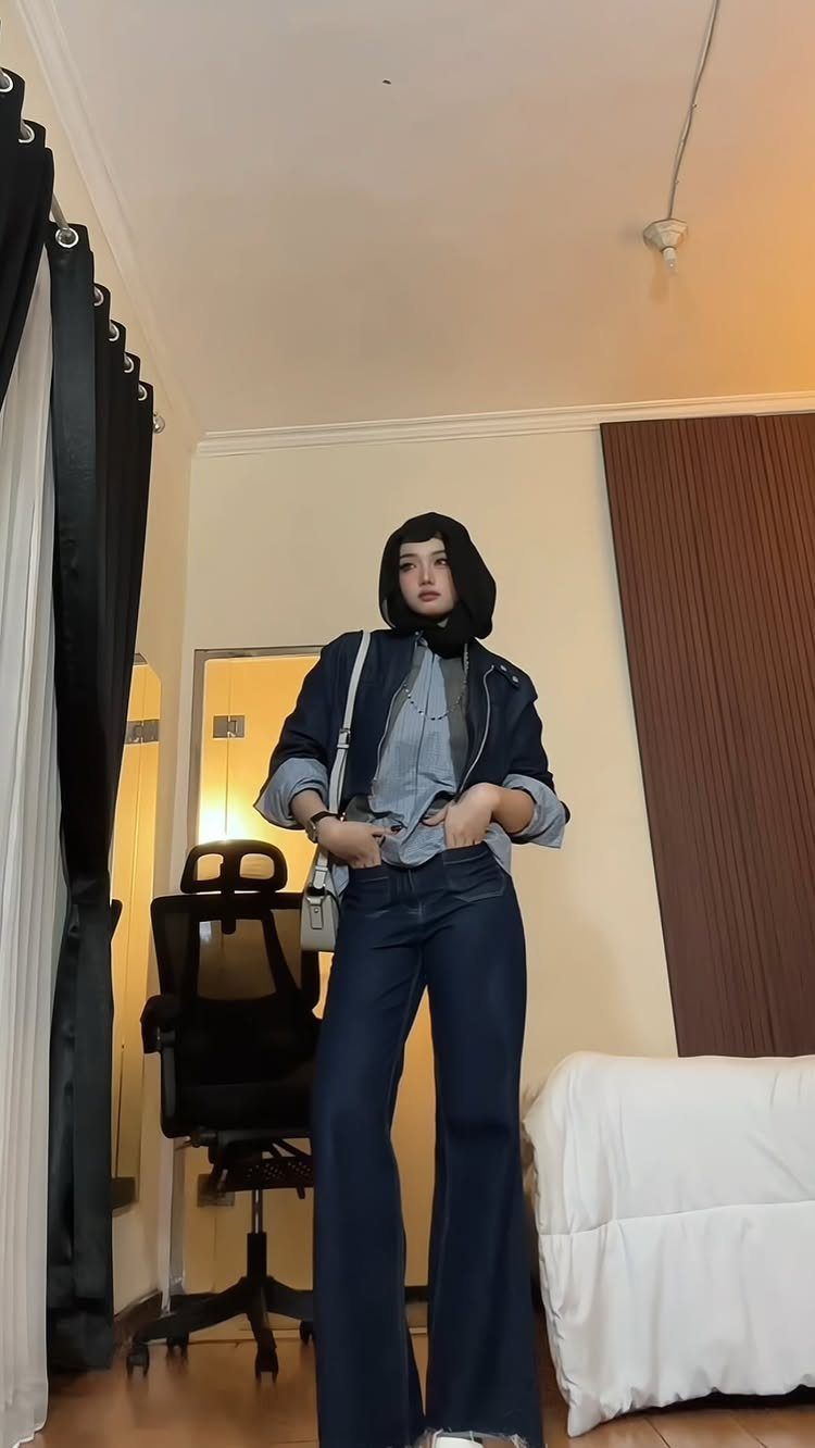57 Degree Weather Outfit: 19 Ideas to Wear Now 3 Person wearing a dark blue denim jacket and wide-leg jeans with a black hijab.