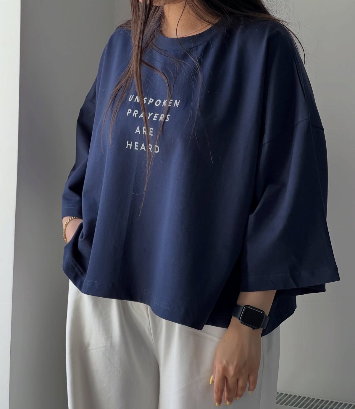 57 Degree Weather Outfit: 19 Ideas to Wear Now 17 Person wearing a navy blue graphic tee with white text and white trousers.