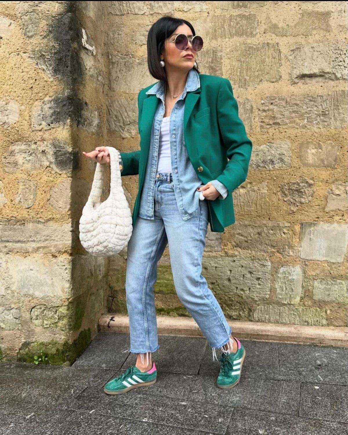 Adidas Outfit Shoes for 5 Casual and Dressed-Up Looks 2 Woman in green blazer and matching green Adidas sneakers standing by stone wall