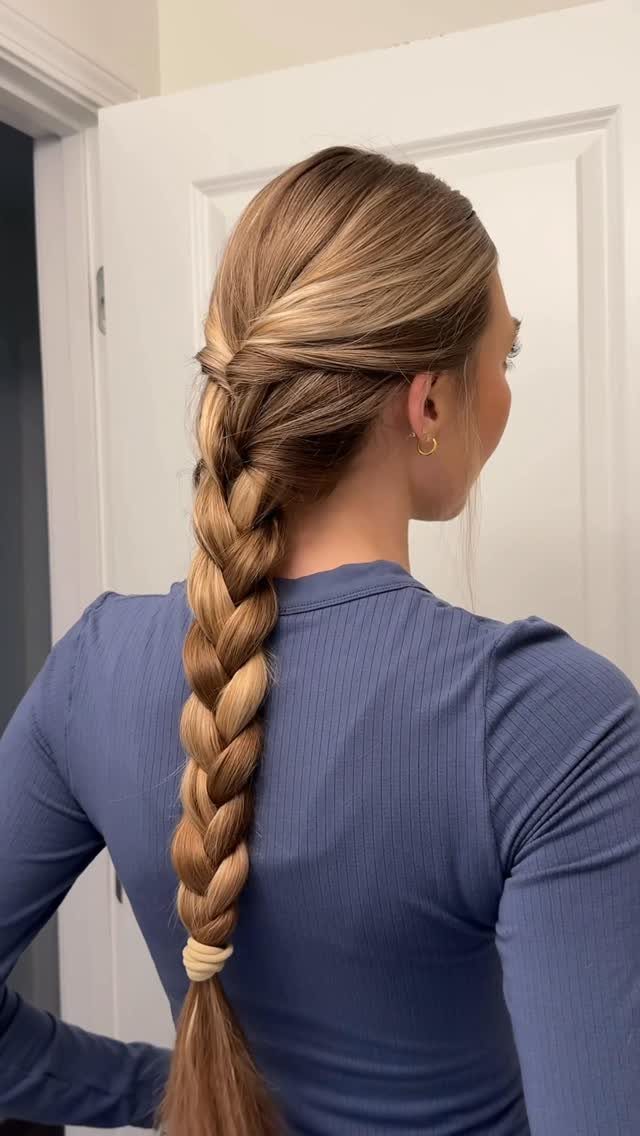 7 Back Hairstyle for Women Ideas, Braids to Buns 3 Blonde woman with a long, thick braid viewed from the back.