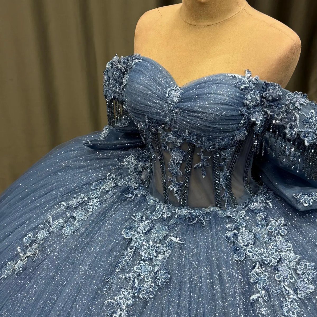 Ball Dresses Blue for Prom and Formal Events: 10 Ideas 10 Steel blue tulle ball gown with floral lace embroidery on a mannequin