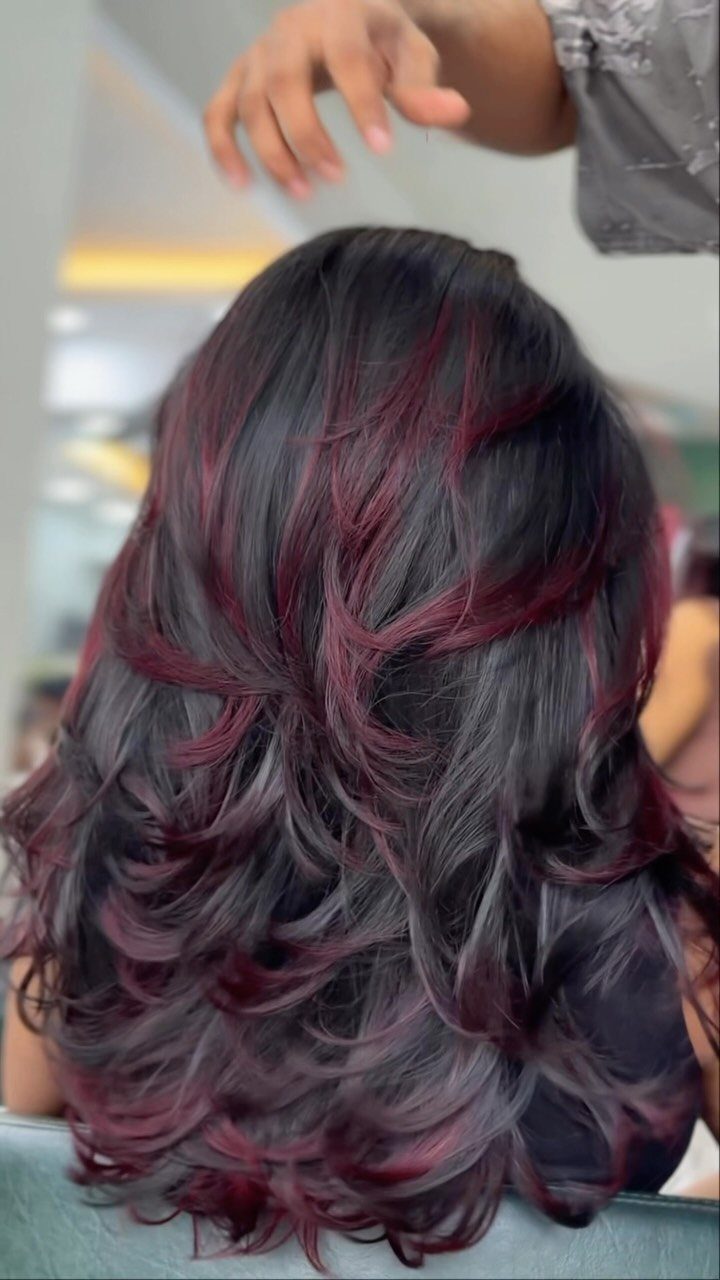 Best Hair Dye for Dark Hair: 8 Shades and Ideas 6 Long wavy dark hair with deep burgundy highlights seen from the back