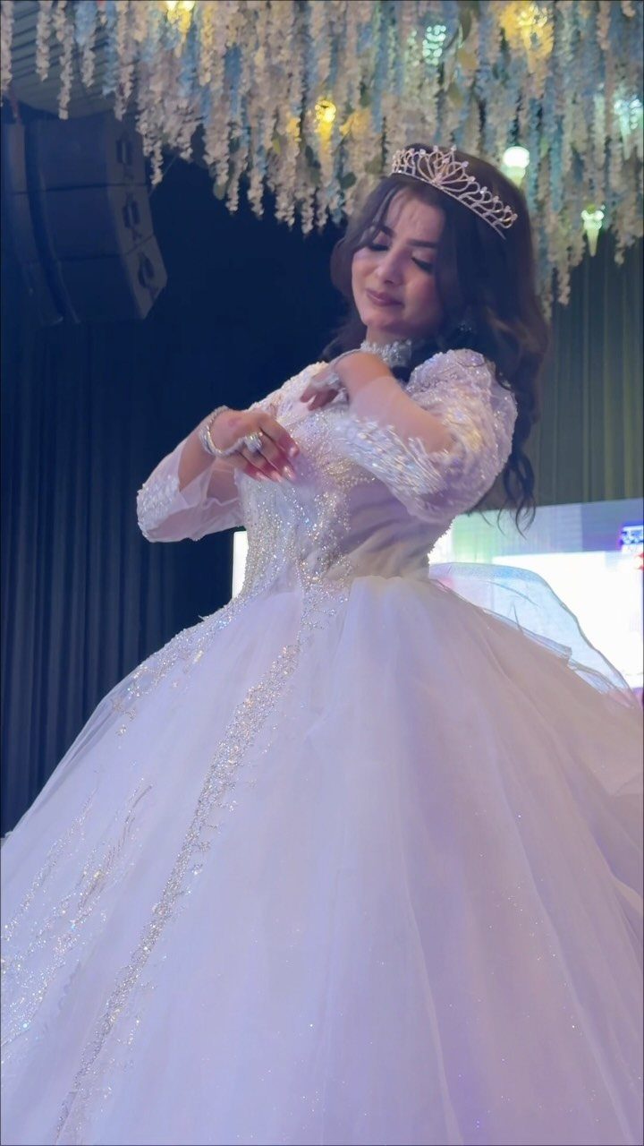 Big Princess Dress Ideas: 7 Tulle, Lace and Satin Gowns 2 Woman in a voluminous white glittery tulle gown wearing a silver tiara.