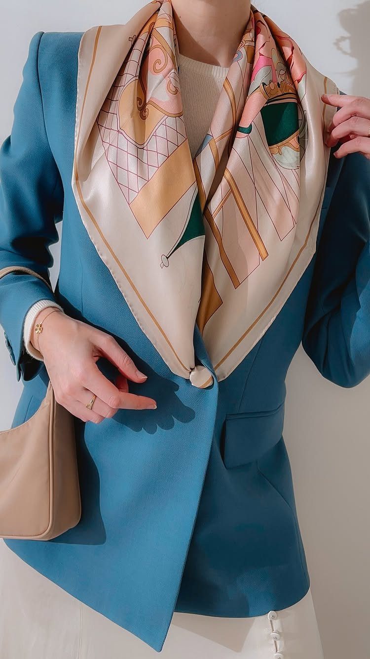 Blue Blazer Outfit for Women: 24 Ideas to Wear 14 Woman wearing a blue blazer and a patterned beige silk scarf with a handbag