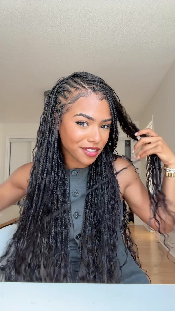 27 Boho Fulani Braids Hairstyles for Every Length and Look 23 Woman with long black Fulani braids and curly boho extensions wearing a black dress