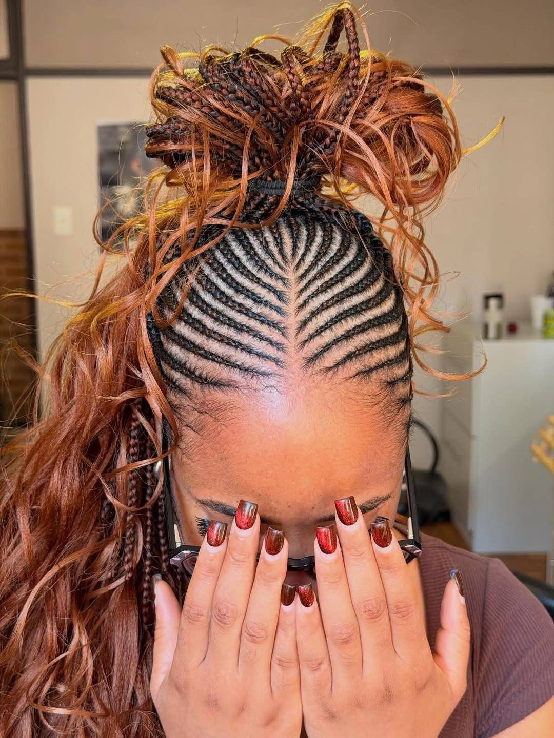 27 Boho Fulani Braids Hairstyles for Every Length and Look 13 Reddish-brown Fulani braids styled into a half top knot with curly ends.