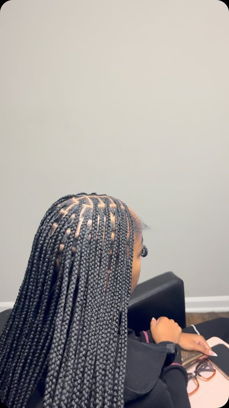 20 Braids and Women Hairstyles to Try in 2026 1 Woman with long black box braids partitioned in square sections on her scalp.