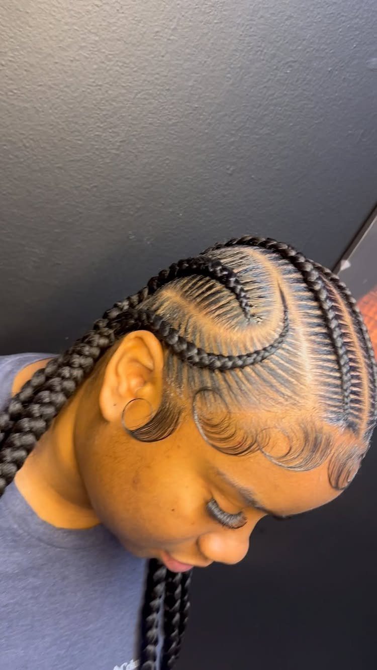 20 Braids and Women Hairstyles to Try in 2026 20 Woman with curved cornrow braids and styled edges in a profile view.