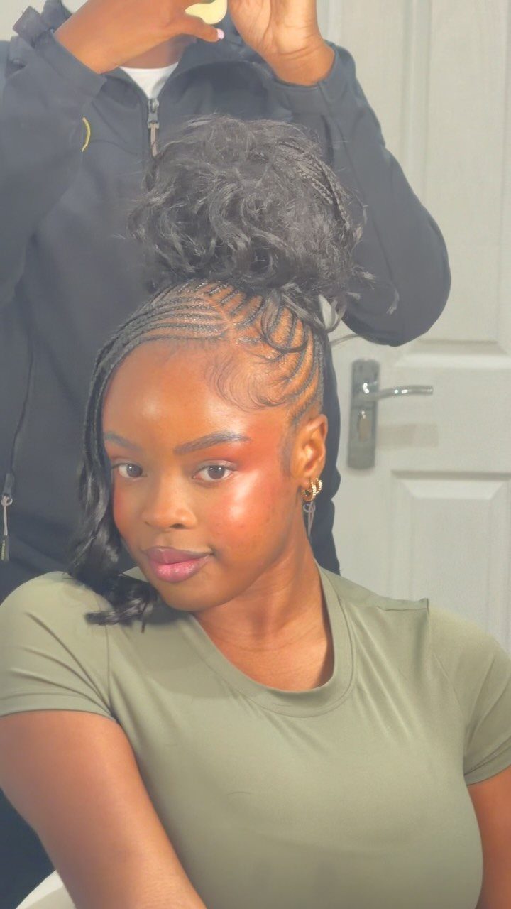 20 Braids and Women Hairstyles to Try in 2026 9 Woman with flat twist braids styled into a high curly bun updo.