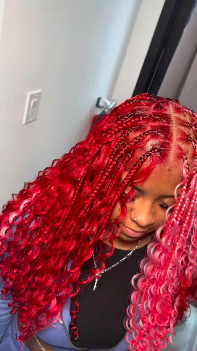 20 Braids and Women Hairstyles to Try in 2026 16 Woman with red and pink Ghana braids ending in long curly hair.