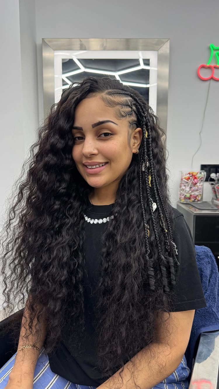 20 Braids and Women Hairstyles to Try in 2026 15 Woman with long curly black hair and thin side braids with silver beads.