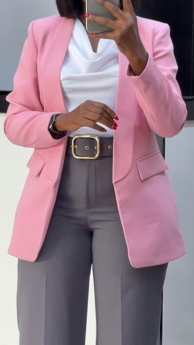 Casual Court Outfit for Women: 6 Ideas to Wear 5 Woman wearing a pink blazer, white top, and grey trousers for a court outfit.