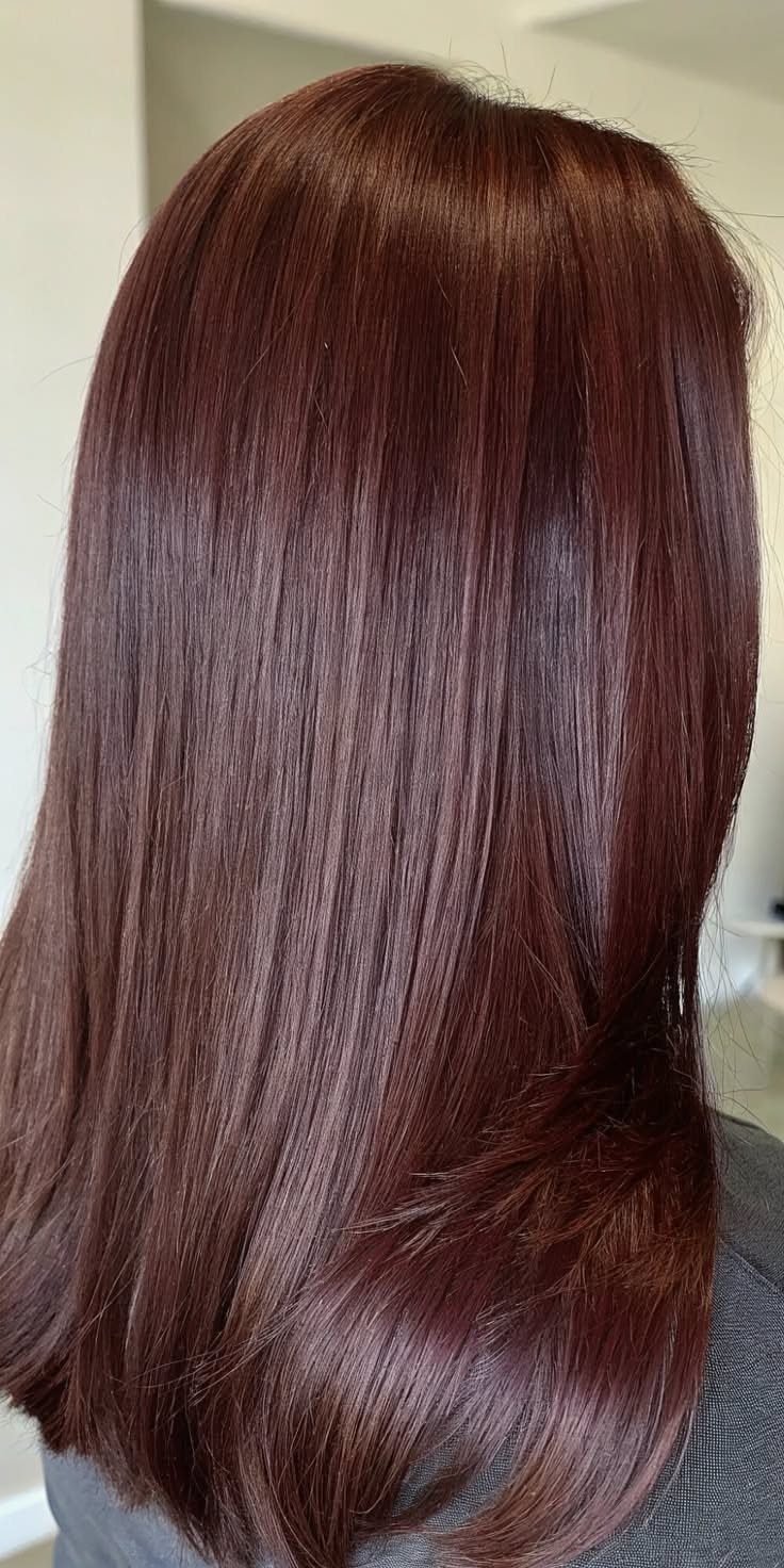 Chocolate Plum Hair: 6 Ideas for Deep Purple-Brown Color 2 Long straight hair in a glossy deep plum and chocolate brown hue.