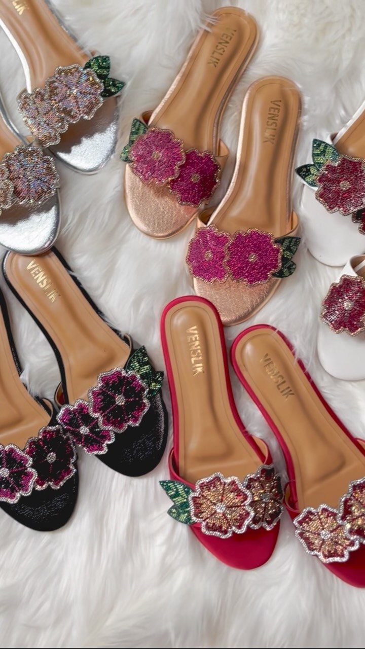 Christmas Outfit for Work: 13 Ideas to Wear to the Office 5 Embellished flat slide sandals in various colors with sparkling floral decorations on white fur.