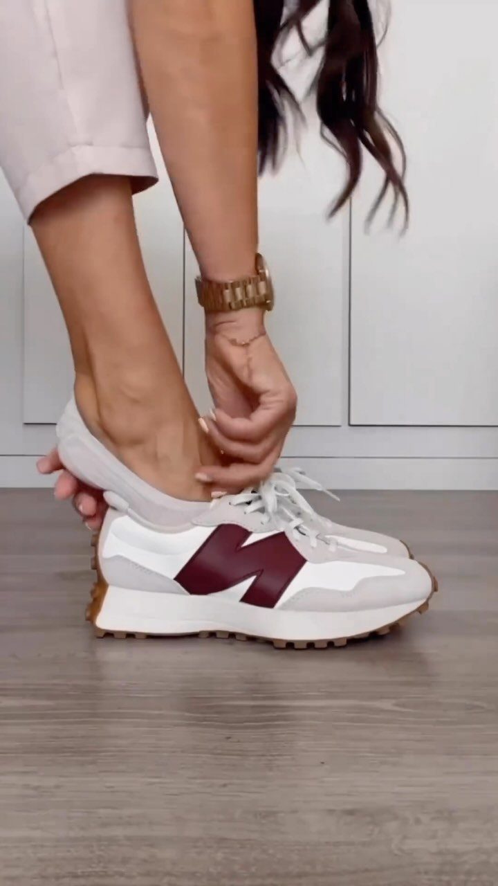 5 Chunky Shoes and New Balance Sneakers Worth Wearing 5 White New Balance 327 sneakers with burgundy logo worn by a person.