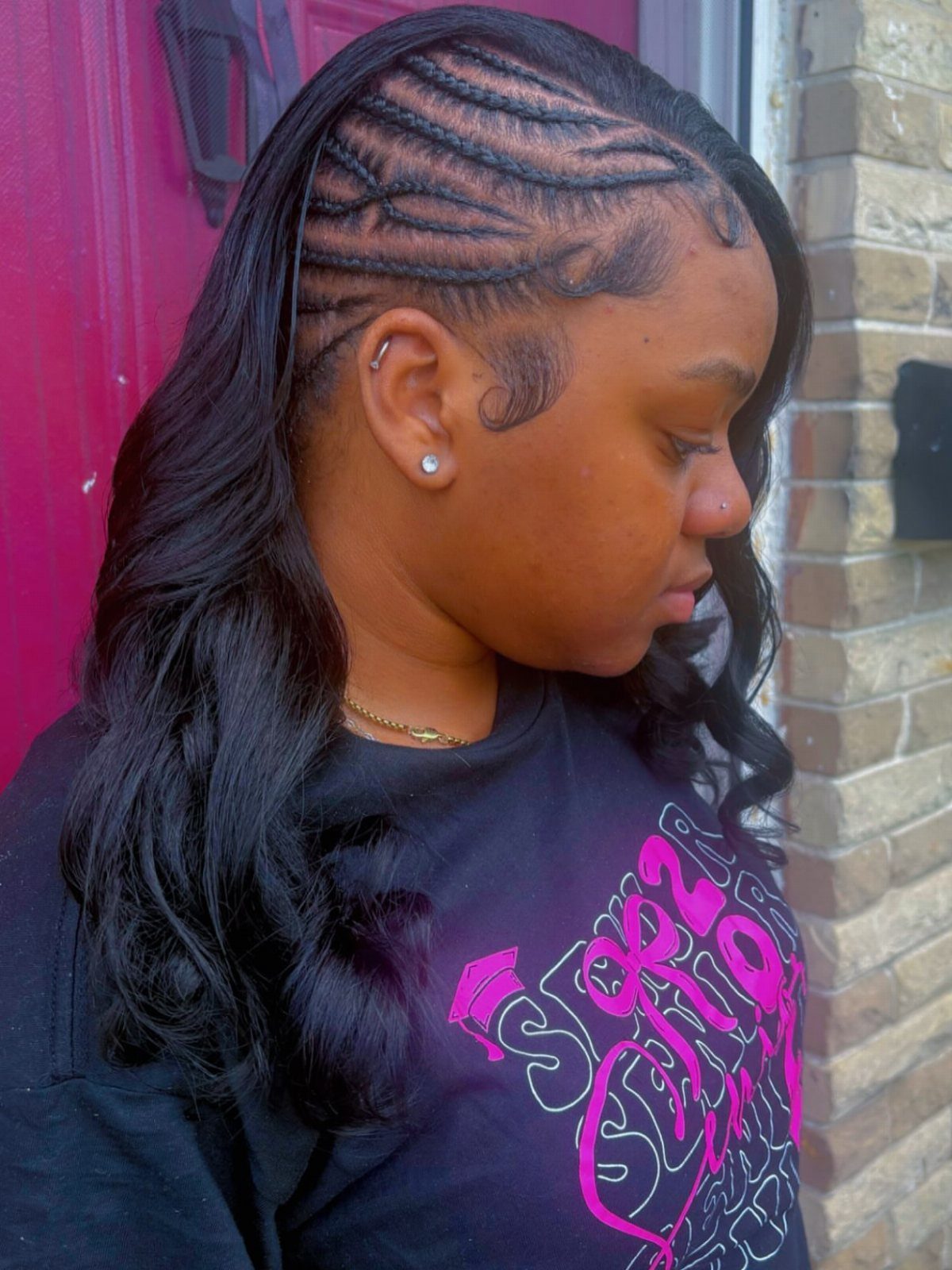 Cornrows and Twists Hairstyles: 11 Ideas to Try 11 Woman with intricate cornrow braids on the side and long wavy black hair.