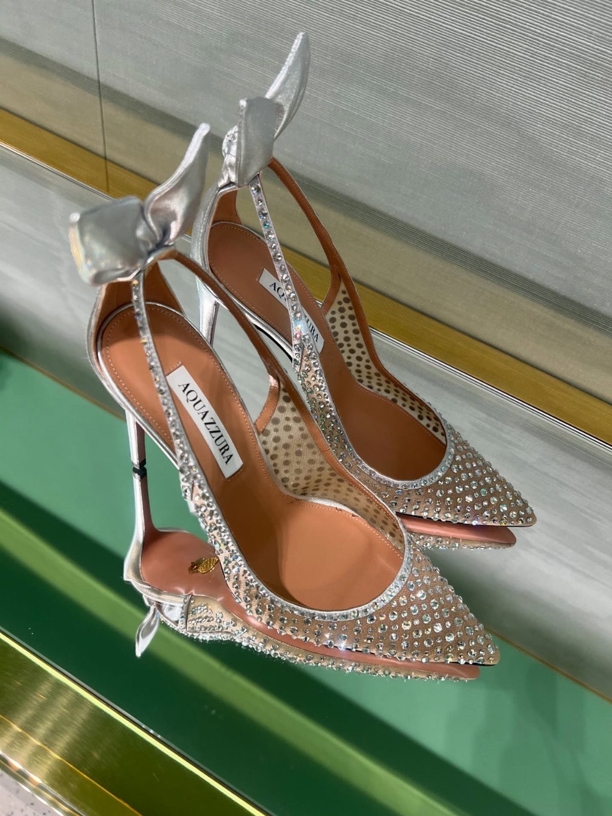 Crystal Embellished Heels: 5 Ideas for Brides and Beyond 2 Silver pointed-toe high heels fully embellished with clear crystals and silver bows.