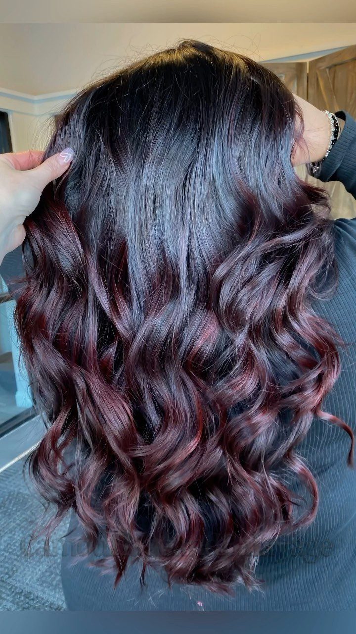 Different Shades of Red Hair Dye: 15 Looks, Copper to Crimson 4 Long wavy hair dyed in a dark black cherry red shade.