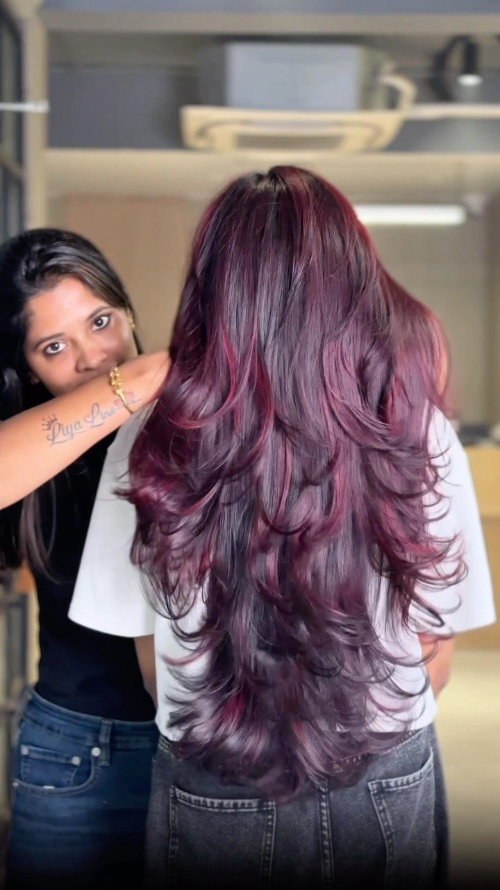 Different Shades of Red Hair Dye: 15 Looks, Copper to Crimson 5 Long layered hair dyed in deep violet-red and plum tones in a salon.