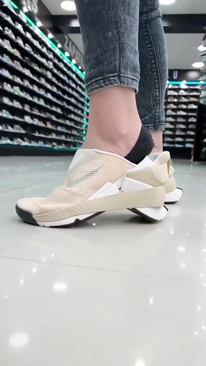 Fancy Sneakers for Women: 9 Ideas, From Retro to Platform 6 Beige slip-on designer sneakers with chunky soles worn with grey denim jeans.