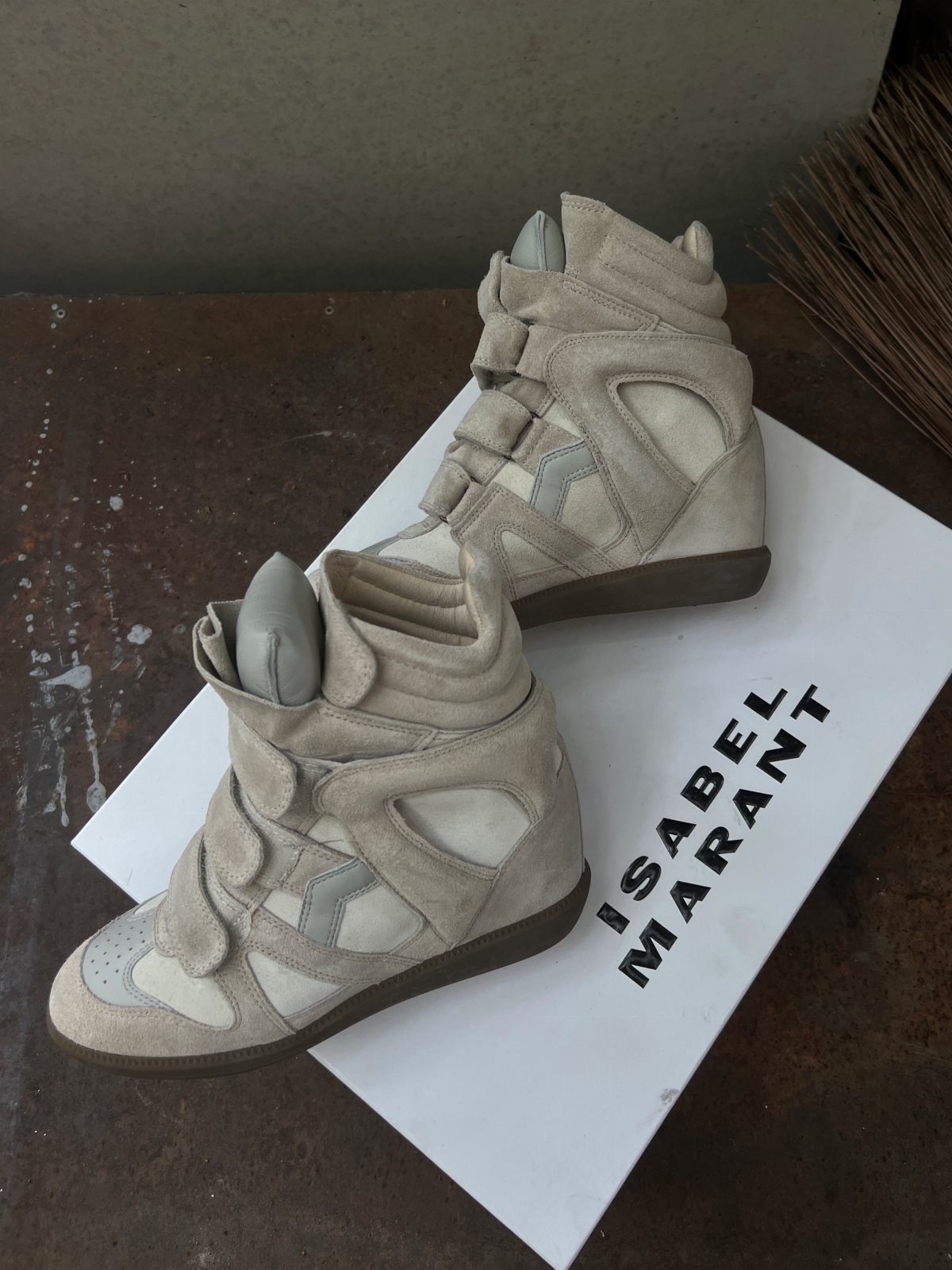 Fancy Sneakers for Women: 9 Ideas, From Retro to Platform 4 Beige leather high-top sneakers with velcro straps on a white designer shoe box.