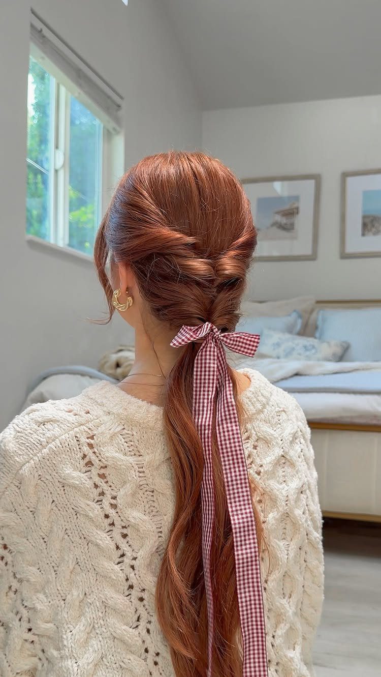 Hair Up Styles to Try: 12 Buns, Ponytails and More 12 Reddish-brown hair in a braided ponytail tied with a red checkered ribbon bow.