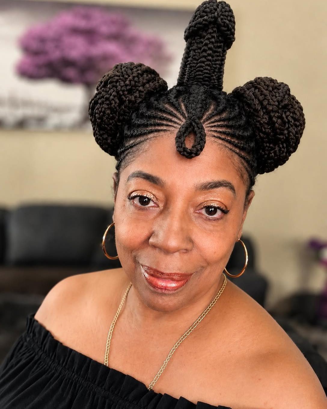 Hair Up Styles to Try: 12 Buns, Ponytails and More 5 Woman with an intricate braided updo featuring three braided buns on top.