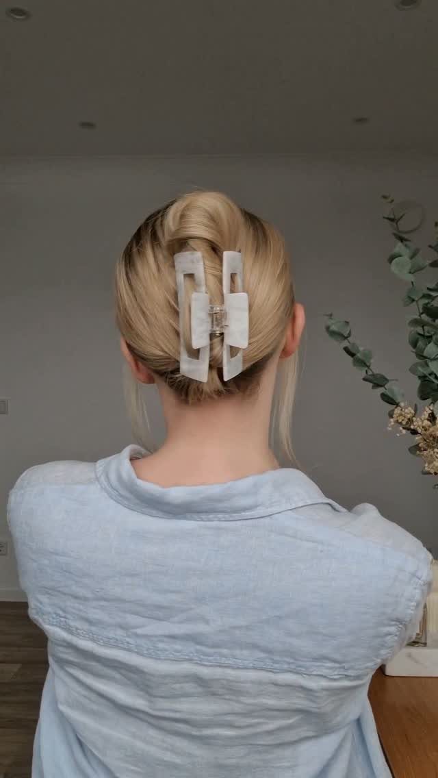 7 Hairstyle for Claw Clip Ideas, Messy Bun to Updo 2 Blonde hair styled in a French twist secured with a white marble claw clip