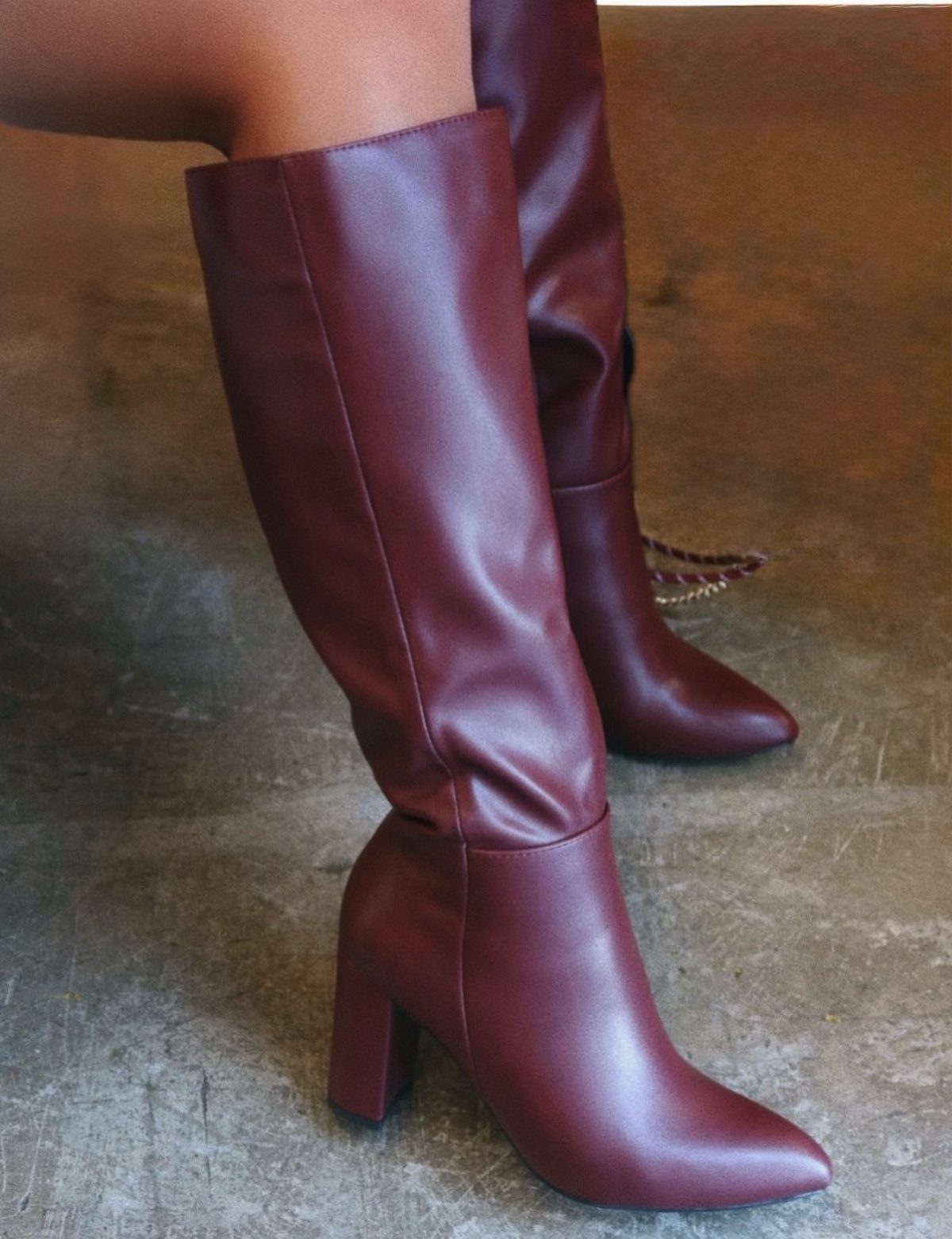 High Cut Boots: 13 Ideas from Kitten Heels to Thigh-High 3 Burgundy knee-high leather boots with block heels on a grey concrete floor