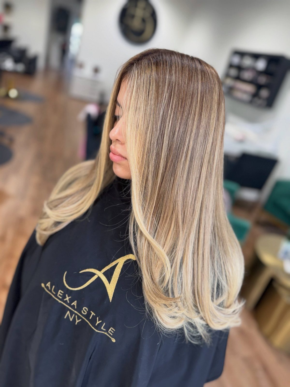 6 Honey Brown Hair with Highlights Ideas for Every Look 1 Woman with honey brown hair and golden blonde highlights styled in loose waves