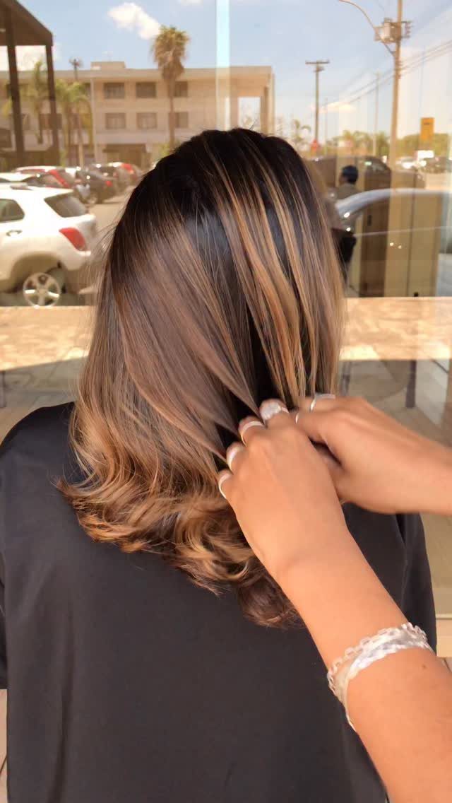 6 Honey Brown Hair with Highlights Ideas for Every Look 4 Honey brown hair with golden blonde highlights styled in soft, voluminous waves.