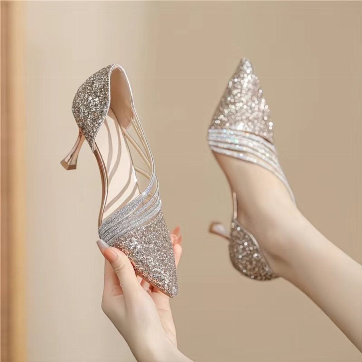 Kitten Heel Shoes for Women: 10 Ideas and Outfits 3 Silver glittery kitten heel shoes with pointed toes held and worn by a woman.