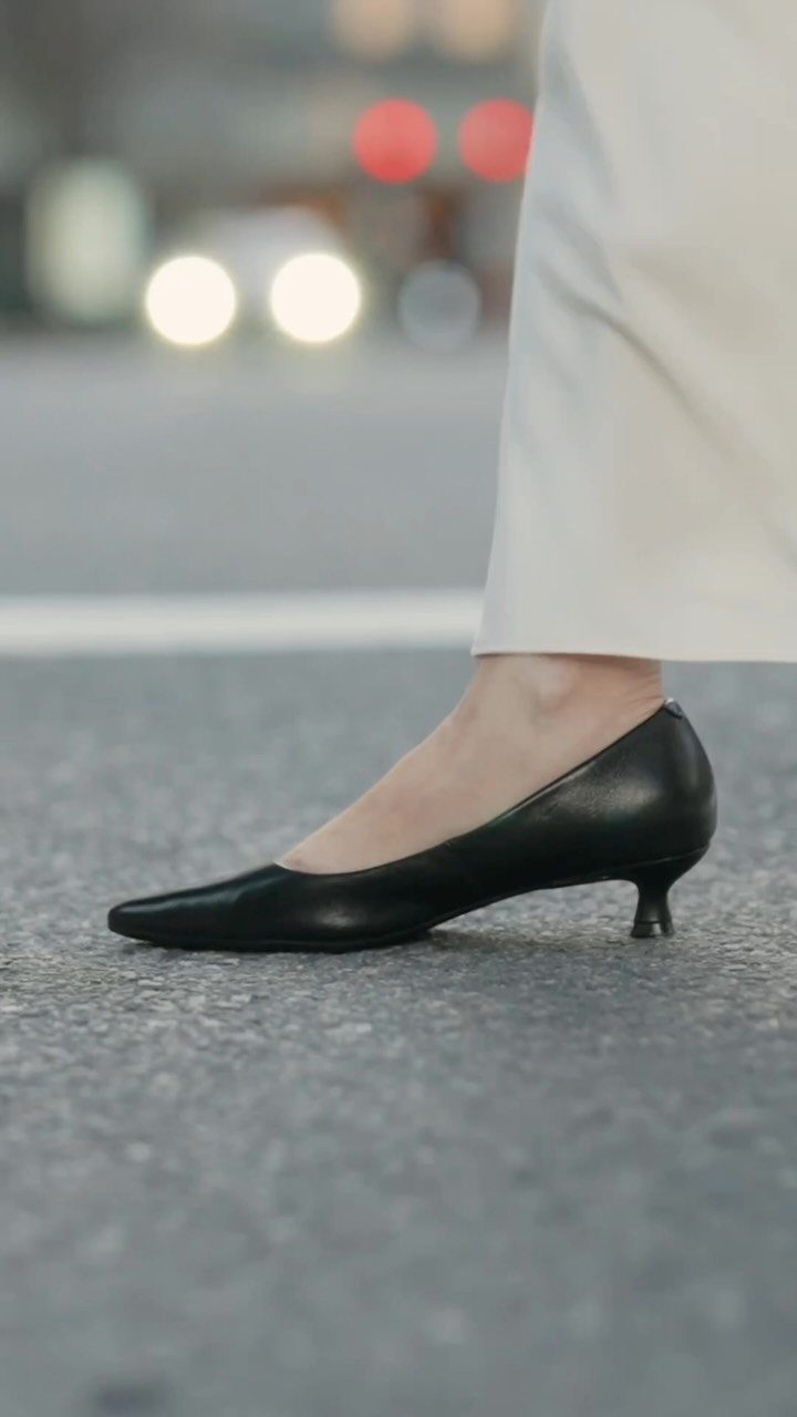 Kitten Heel Shoes for Women: 10 Ideas and Outfits 2 Black leather kitten heel pumps paired with white tailored trousers on a city street