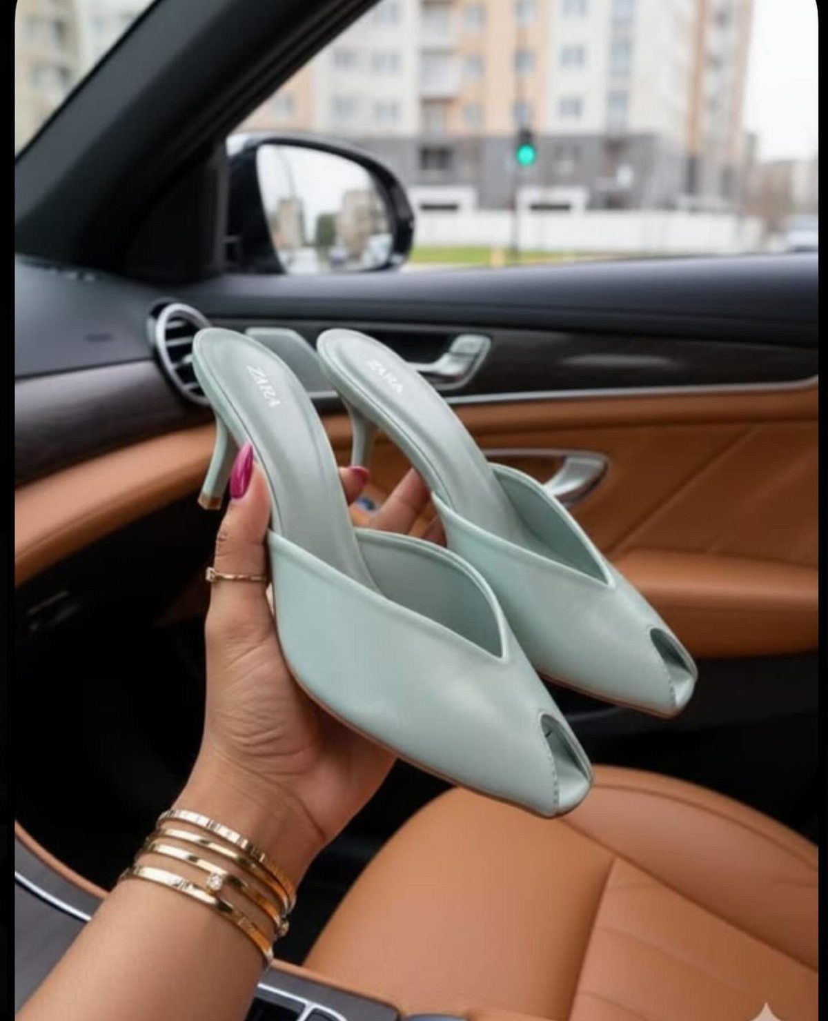 Kitten Heel Shoes for Women: 10 Ideas and Outfits 10 Light mint green kitten heel pumps held by a hand inside a car