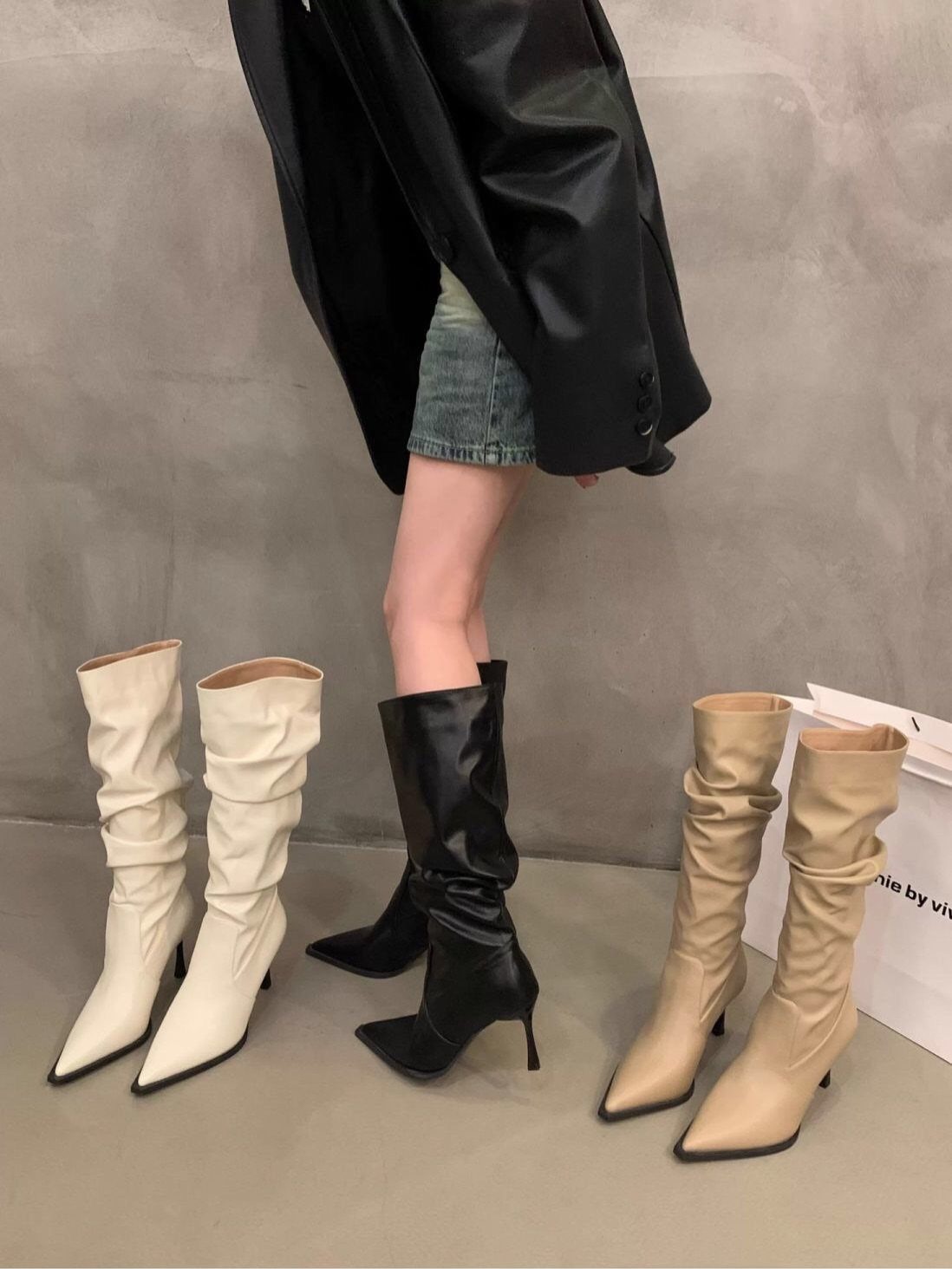 8 Leather High Heel Boots Ideas for Every Outfit 1 Black, white, and beige leather high heel boots with a slouchy design.