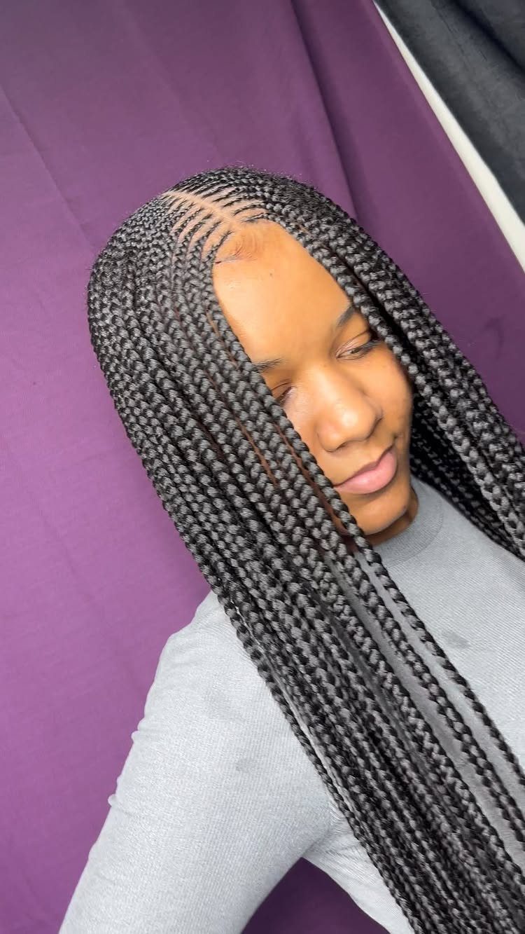 5 Middle Part Tribal Braids with Beads, Curls and More 3 Woman with long black tribal braids and a middle part against purple background