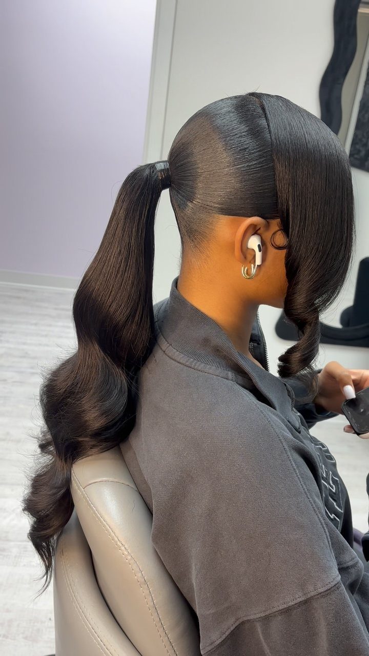8 Prom Ponytail Hairstyles from Sleek to Curly 1 High sleek ponytail with a hair wrap and voluminous curls on dark hair.