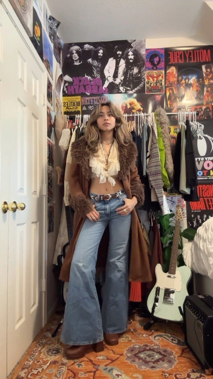 6 Retro Bell Bottoms Ideas for Every Closet and Mood 3 Woman wearing light blue bell bottom jeans and a white flowy cropped blouse.