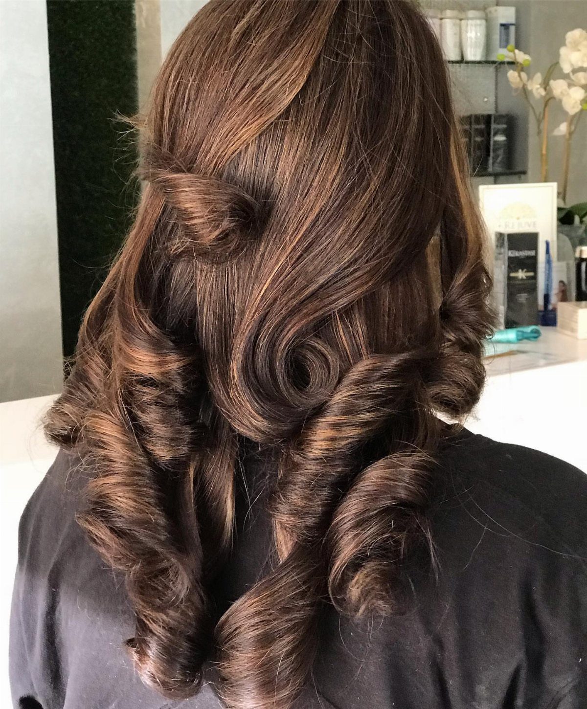 20 Summer Hair Dye Ideas, from Pastel Blue to Cool Raven 10 Long curly brown hair with warm caramel highlights styled in voluminous ringlets.