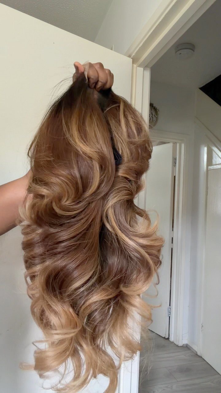 20 Summer Hair Dye Ideas, from Pastel Blue to Cool Raven 7 Long curly hair with a golden ombre transition from dark brown to blonde.
