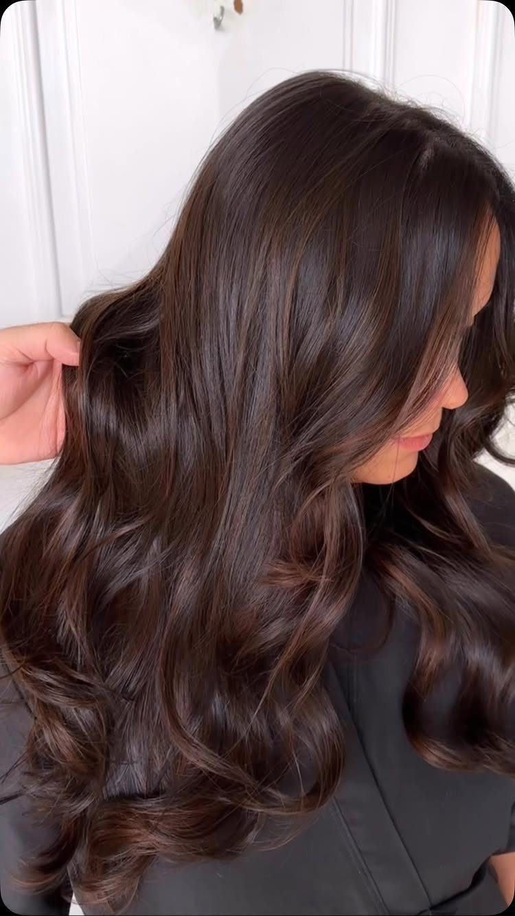 20 Summer Hair Dye Ideas, from Pastel Blue to Cool Raven 13 Long wavy chocolate brown hair with rich multidimensional highlights on a woman.